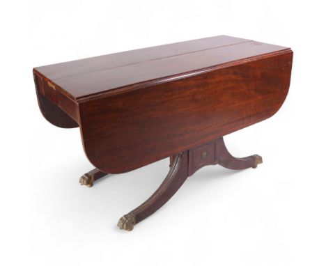 A Regency mahogany "Edwards Patent" dining table, with concertina action, 3 additional leaves and drop-leaf ends, on sabre le