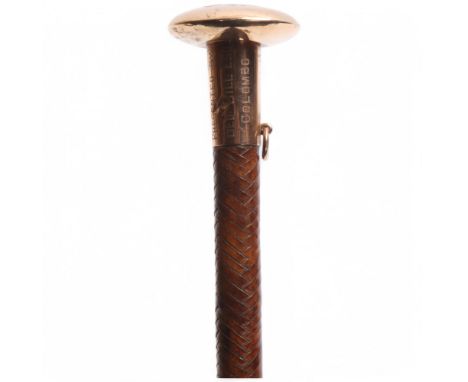 An unmarked gold-topped woven leather riding whip, handle inscribed Christmas 1918 presented by Geo Hill Esq Colombo, length 