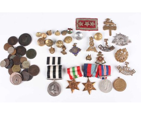 A collection of medals, badges and coins, including a First World War Victory Medal to '2040 Pte. A. Saunders, E. Kent R', a 