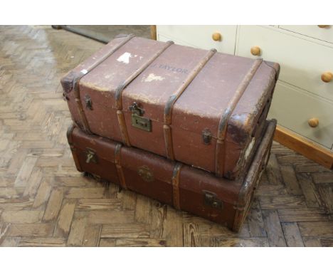 A vintage canvas and wood bound trunk plus another travelling trunk