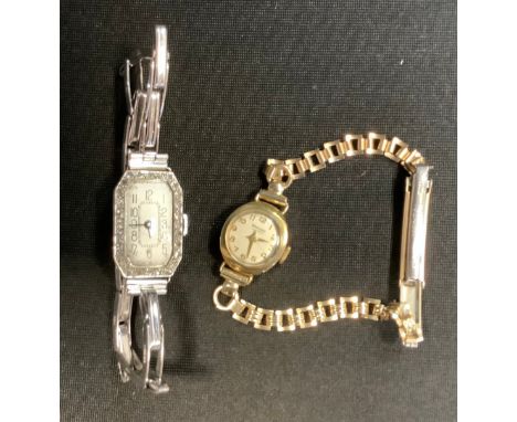 A 1930s platinum and diamond cocktail watch, tonneau silvered dial, Arabic numerals, 15 jewel Swiss manual wind movement, cas