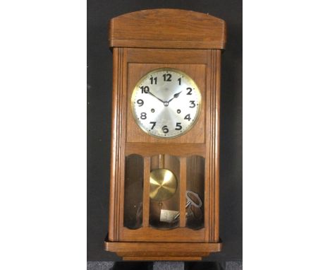 A Junghans oak wall clock, silvered dial, Arabic Numerals, eight day movement, 53.5cm x 26cm 