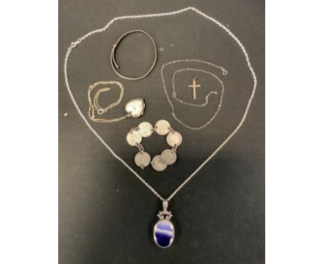 A silver mounted oval pendant, set with an amethyst; a silver heart locket;  silver child's bangle;  etc 