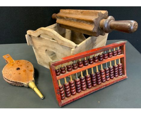 A large oak fluted rolling pin, 60cm long, a wooden and brass bellows, a pine basket, etc. 