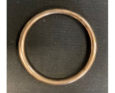 A 9ct gold bangle, 13.7g 