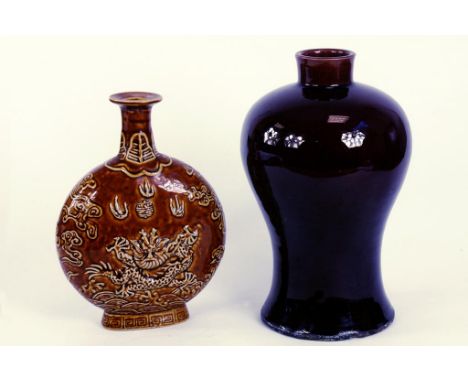 A CHINESE AUBERGINE GLAZED STONEWARE VASE, DRILLED AND A CHINESE BROWN GLAZED DRAGON FLASK