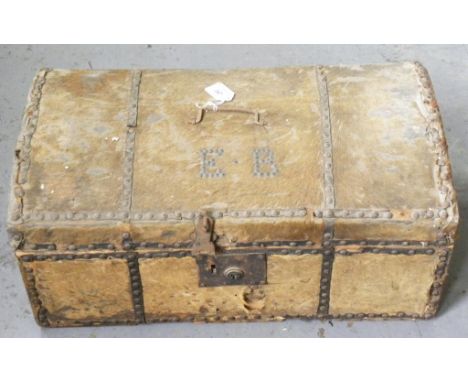 A GEORGE III PONY SKIN COVERED WOOD TRUNK WITH DOMED LID, THE UNDERSIDE RETAINING THE ORIGINAL ENGRAVED TRADE LABEL OF SEABRO