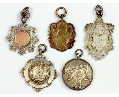FIVE SILVER WATCH FOB SHIELDS, TWO CAST IN SHALLOW RELIEF WITH FOOTBALLERS, VARIOUS MAKERS AND DATES, EARLY 20TH CENTURY, 1 O