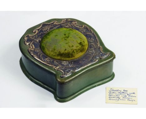 AN ART NOUVEAU SILVER MOUNTED GREEN LEATHER JEWEL BOX, THE LID CENTRED BY A PIN CUSHION, THE MOUNT EMBOSSED WITH ROSEMARY, BI