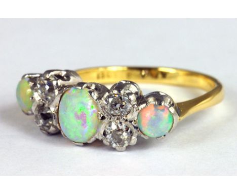 A DIAMOND AND OPAL RING, IN GOLD MARKED 18CT P, 3G