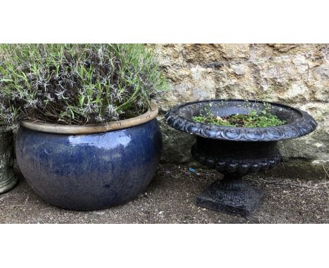 A large blue glazed ceramic planter, approx 32cmH 56cmD; together with a cast metal urn planter, 35cmH 49cmD 