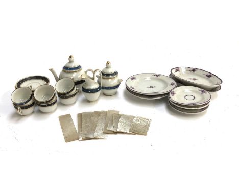 A 19th century doll's teaset, comprising teapot, six teacups and saucers, milk jug, and lidded sugar pot; together with furth