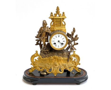 An early 20th century French gilt metal figural mantel clock, enamel dial with Roman numerals, with key and pendulum, 40cmH 