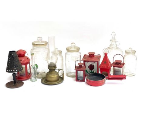 A mixed lot of glass jars, demijohn, oil lamp, various tin lanterns, etc 