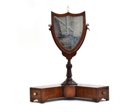 A small mahogany frame shield shape toilet mirror on stirrup supports and L shaped base with two small drawers, bone paterae 