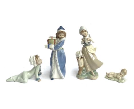 Three Lladro figures: 'Baby on Floor', model no 5101; 'Baby Jesus', model no. 4670; 'Girl with Pigeons', model no. 4915; with