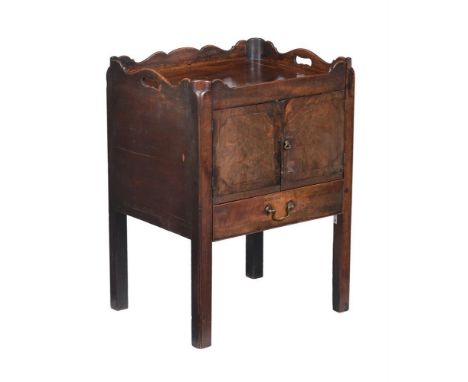A George III mahogany tray top night commode, the gallery with cutout handles, over a pair of doors and converted drawer, on 