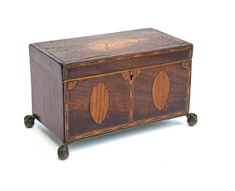A George III mahogany and inlaid tea caddy, on brass ball and claw feet, 22cmW 