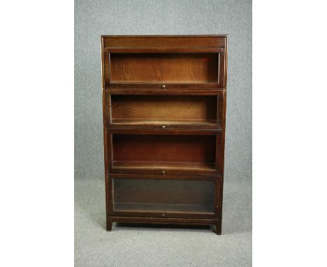 Bookcase, mid century Globe Wernicke style mahogany in four sections with maker's mark to the back. H.146 W.87 D.25cm. (Top t