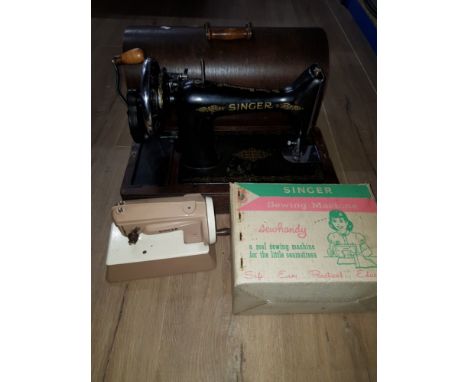 A VINTAGE SINGER SEWING MACHINE TOGETHER WITH A BOXED EDUCATIONAL SINGER SEWING MACHINE