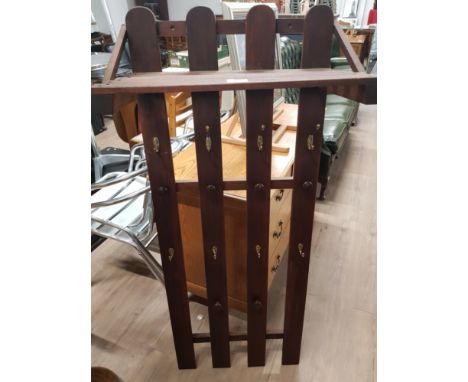 A MODERN HALL UNIT WITH SHELF AND COAT HOOKS