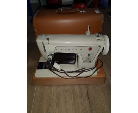 A VINTAGE SINGER SEWING MACHINE