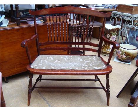 An early 20th Century two seater high backed bench with beading. 