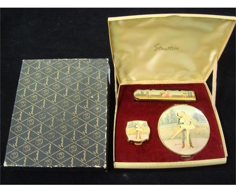 A Stratton compact set, in original case and box comprising comb, powder compact and pill box. 