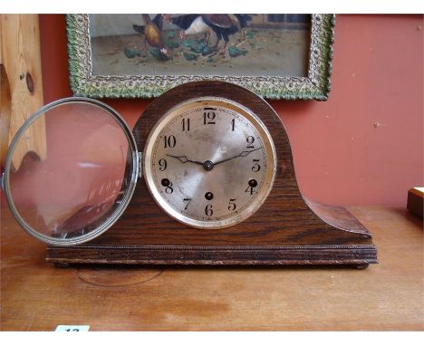 An eight day mantle clock, with Arabic numerals, an option for silent chime, chiming every fifteen minutes and with key. 