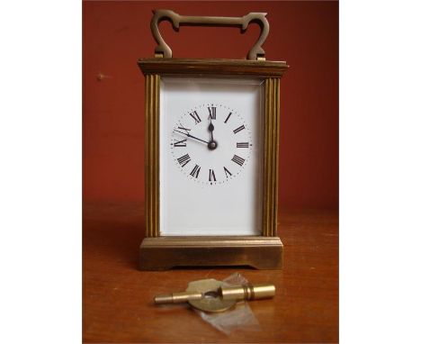 A 19th Century brass carriage clock, Swiss made  movement, with key. 
