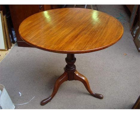 A pedestal tripod occasional table.