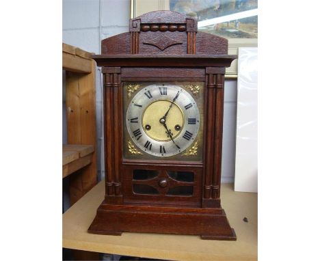A mantle clock, HAC (Hamburg-American Corporation), made in Wurtenberg, with Roman numerals, foliate decoration and with key.