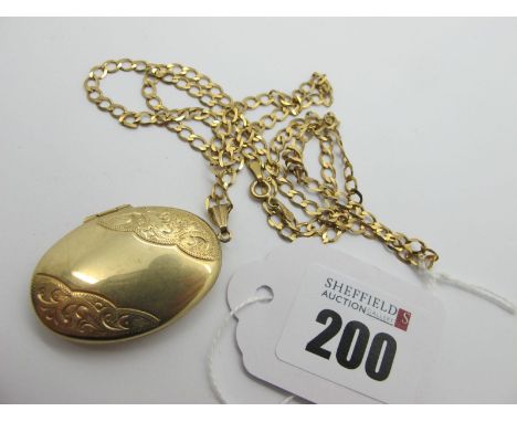 A Modern 9ct Gold Oval Locket Pendant, scroll engraved, on a 9ct gold curb link chain. 