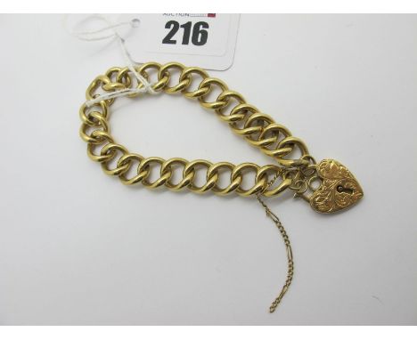 A Solid Curb Link Bracelet, to a heart shape padlock style clasp stamped "750" (safety chain broken) (overall weight 40grams)