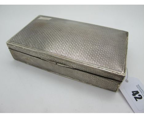 A Hallmarked Silver Cigarette Box, Chester 1927, of rectangular form allover engine turned, 15.5cm wide.  