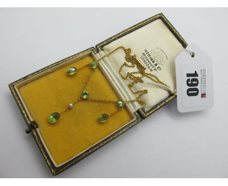 An Edwardian Peridot Set Necklace, circular and oval set, on knife edge bars with seed pearl highlight, to integral fine chai