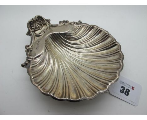 A Hallmarked Silver Shell Dish, Walker &amp; Hall, Sheffield 1897, raised on three ball feet, 135grams. 