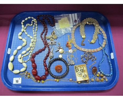 A c.Early XX Century Long Chain Necklace, with foil bead highlights, together with a graduated single strand cherry amber col