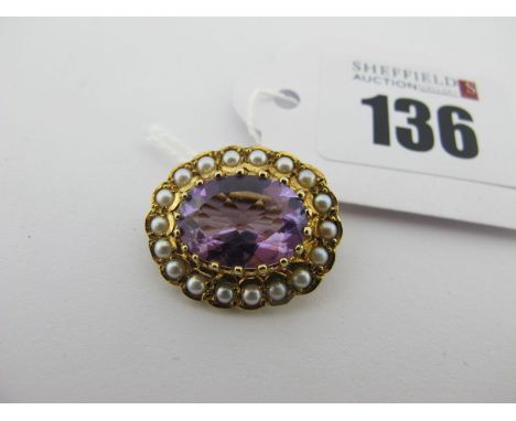 A 9ct Gold Amethyst and Pearl Set Brooch, of antique style, oval claw set to the centre, 2.3cm wide. 