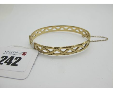 A 9ct Gold Hinged Bangle, of openwork design (12grams). 