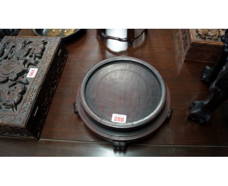 A Chinese hardwood circular stand, aperture 18cm diameter.