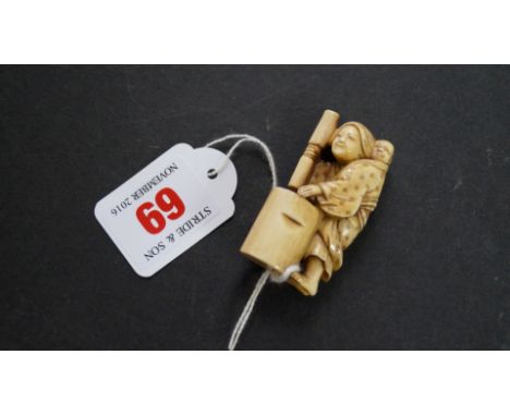 A Japanese carved ivory netsuke, Meiji period, of a washer woman with a small child on her back, 5.3cm high. Condition Report