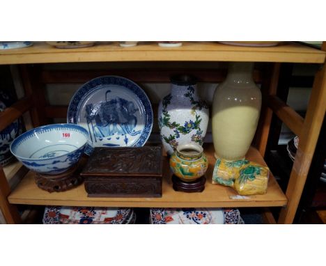 A mixed lot of Oriental items, comprising: a Chinese yellow glazed vase, seal mark, 30.5cm high; a blue and white bowl, 17.5c