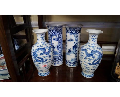 A pair of Chinese blue and white vases, Yongzheng seal marks, each painted with a pair of five-clawed dragons chasing a flami