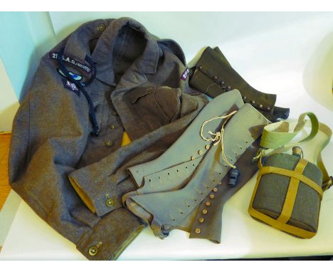 A British Army battledress blouse 1949 pattern, size 16 with 21st SAS (Artists); a water bottle with a webbing strap; two pai