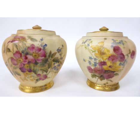 A matched pair of Royal Worcester blush ivory glazed and gilded china jars of melon design, decorated with floral sprigs&nbsp
