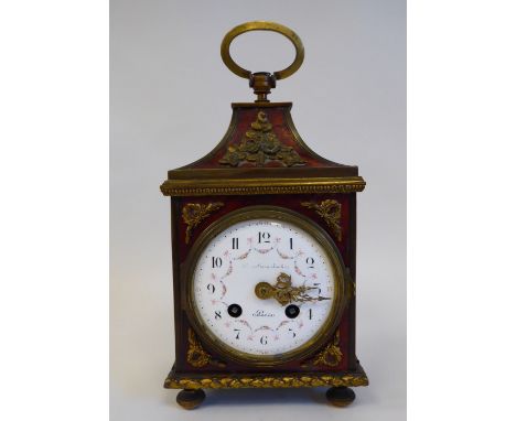 A late 19thC/early 20thC Parisian tortoiseshell and brass cased mantel clock with a pagoda top and applied floral mounts; the
