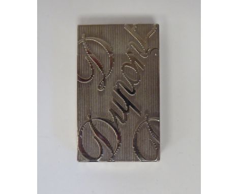 A Dupont rectangular, stainless steel cased, gas filled cigarette lighter, decorated in large script with the maker's name an