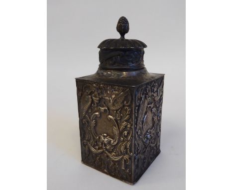 A late Victorian silver tea caddy of shouldered, rectangular box design, the cover incorporating a bud finial, allover emboss
