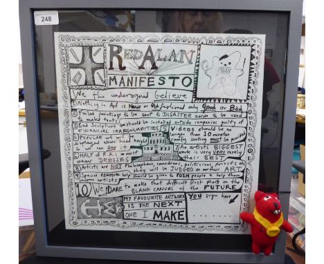 A Grayson Perry 'Red Alan Manifesto' printed paper panel&nbsp; 13"sq&nbsp; framed; with a Red Allen toy